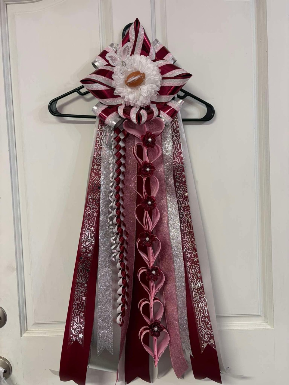 Burgundy and silver homecoming ribbon arrangement