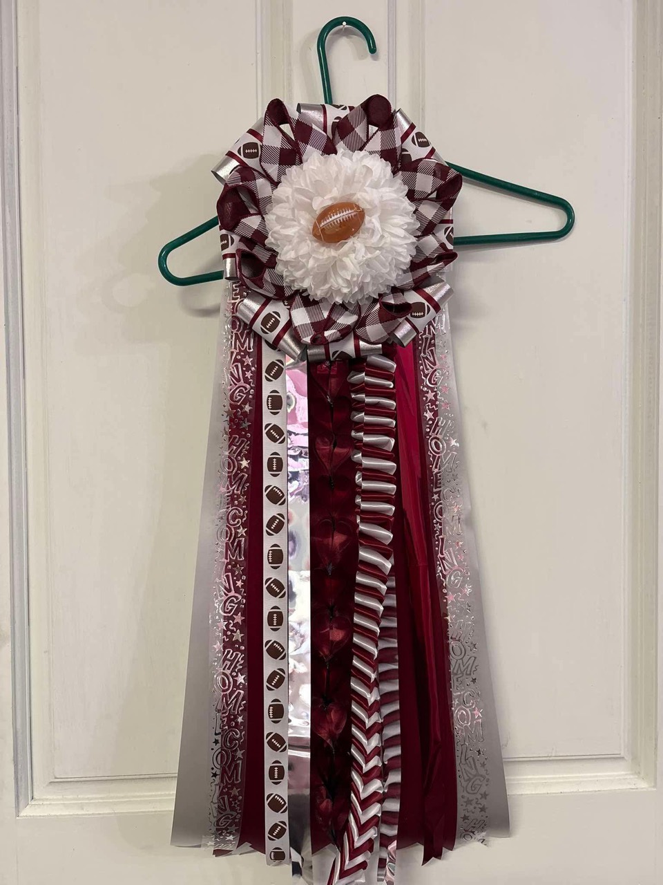 Burgundy football-themed ribbon arrangement