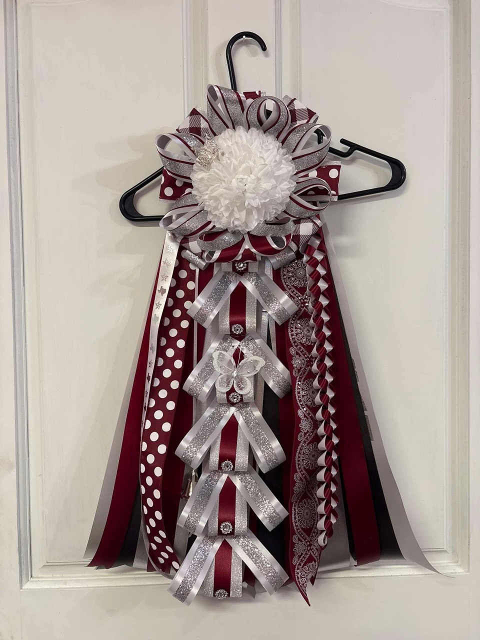 Burgundy, white, and silver ribbon arrangement with butterfly details