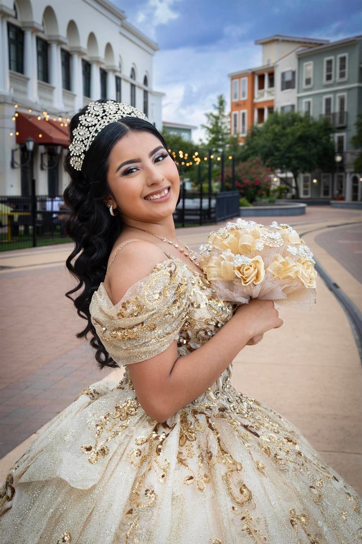 Quinceañera portrait in a gold gown