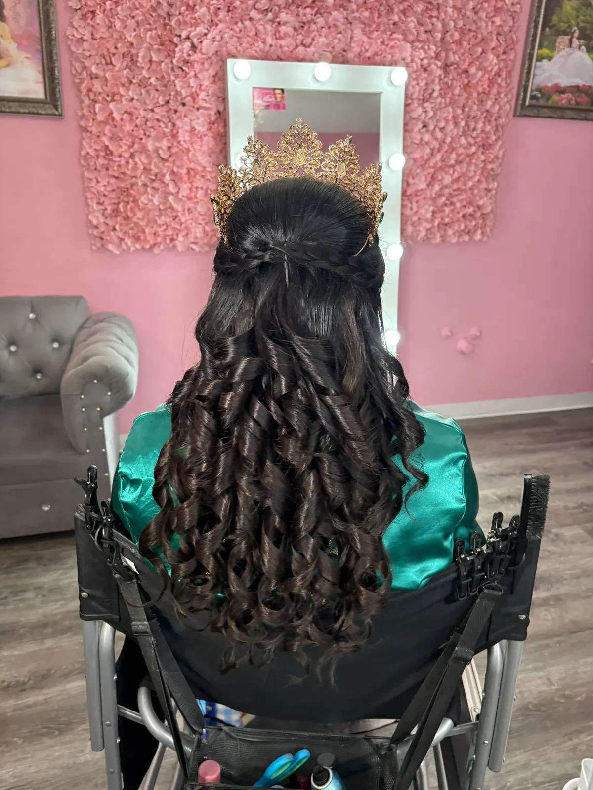 Half-up quinceañera hairstyle viewed from behind