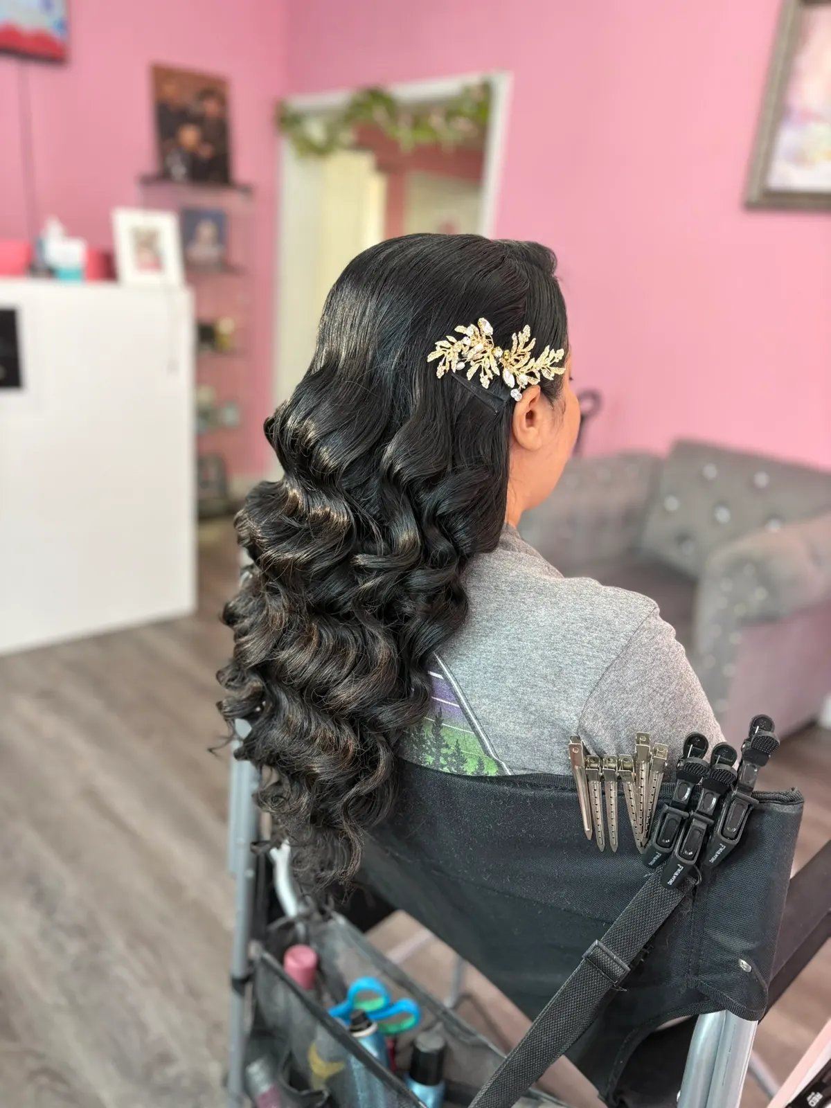Curled half-up hairstyle with a jeweled hair accessory