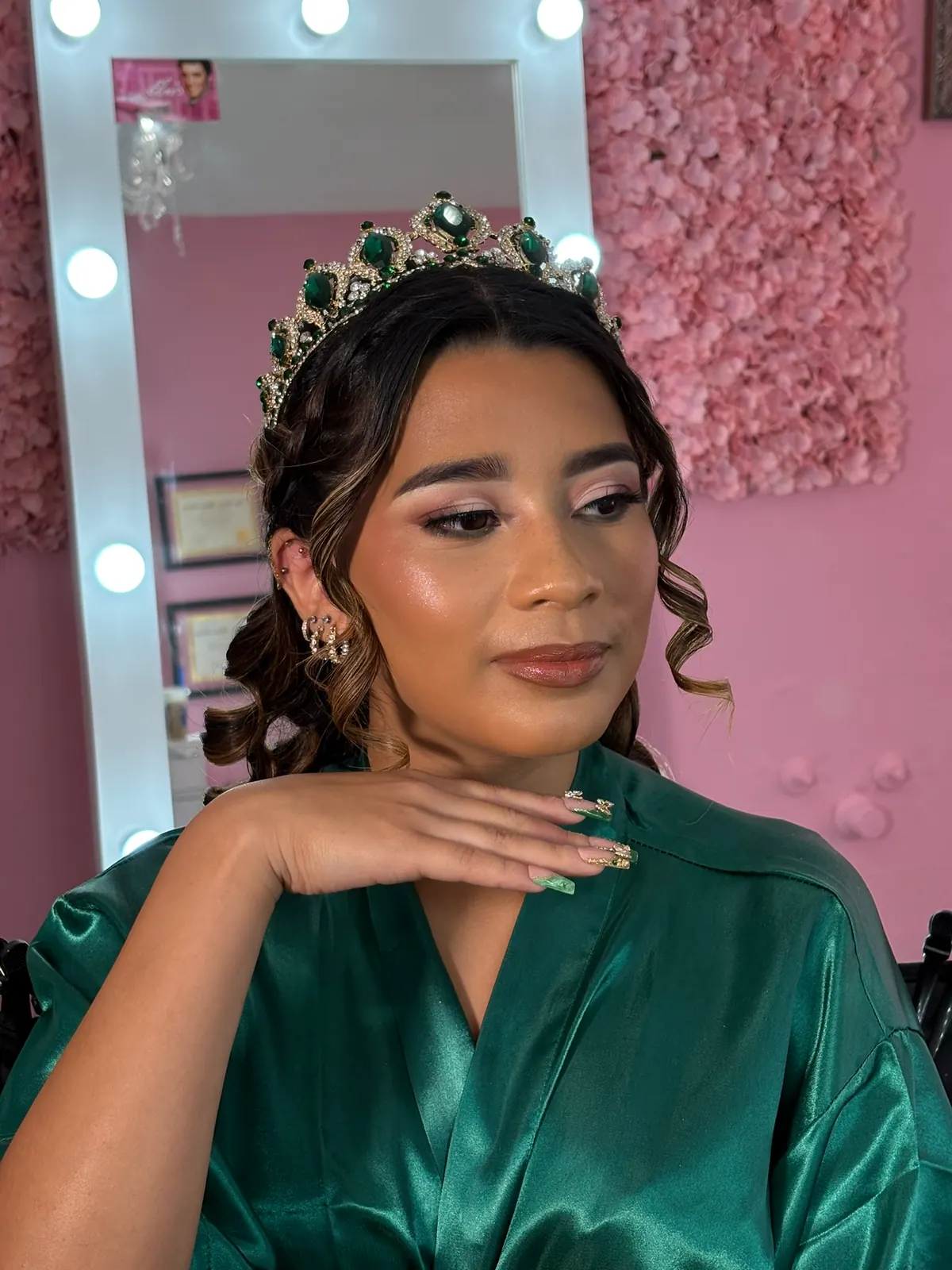 Close quinceañera makeup portrait with green robe and tiara